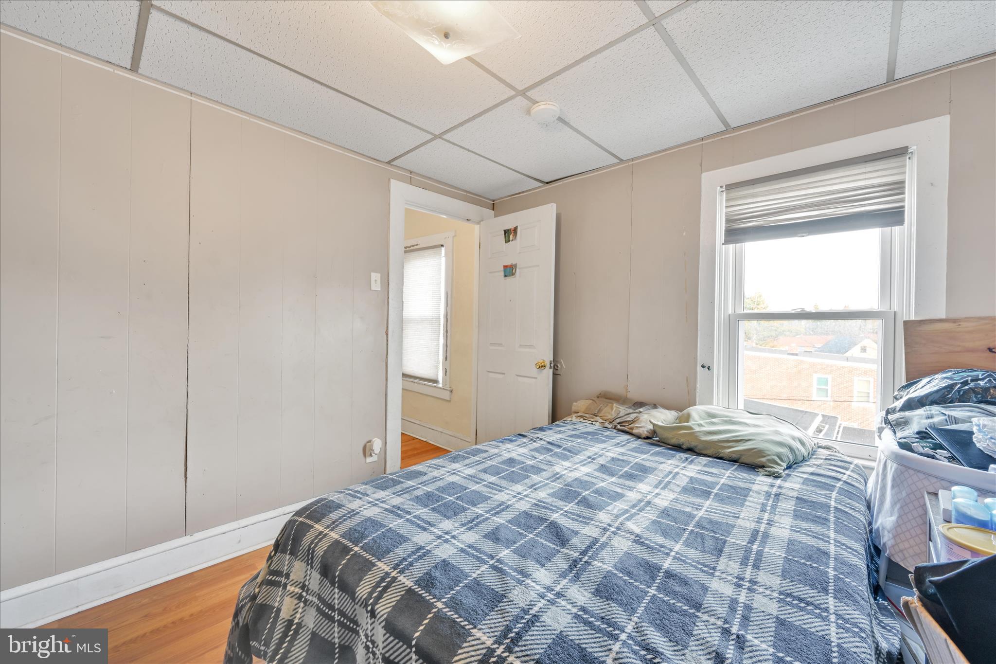 153 North Broad Street Lancaster, PA 17602 - Photo 34 of 38 a bedroom with a bed and a window