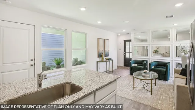 a kitchen with a table and chairs in it