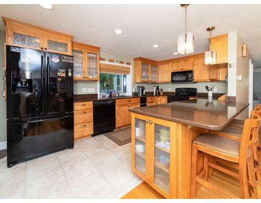 6 Longfellow Road Natick, MA 01760 - Photo 1 of 29 a kitchen with stainless steel appliances granite countertop a refrigerator a stove and a sink