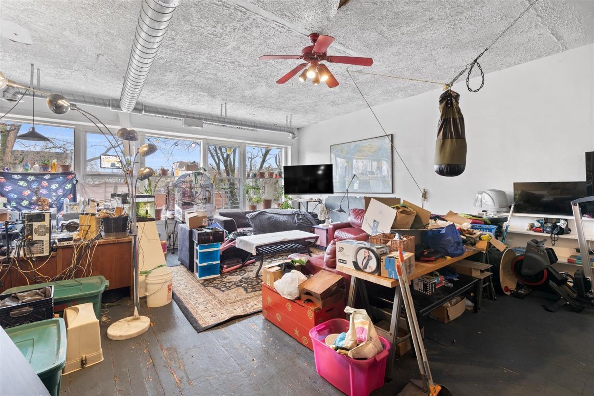2605 West Division Street Chicago, IL 60622 - Photo 3 of 28 a living room with lots of furniture and a clock