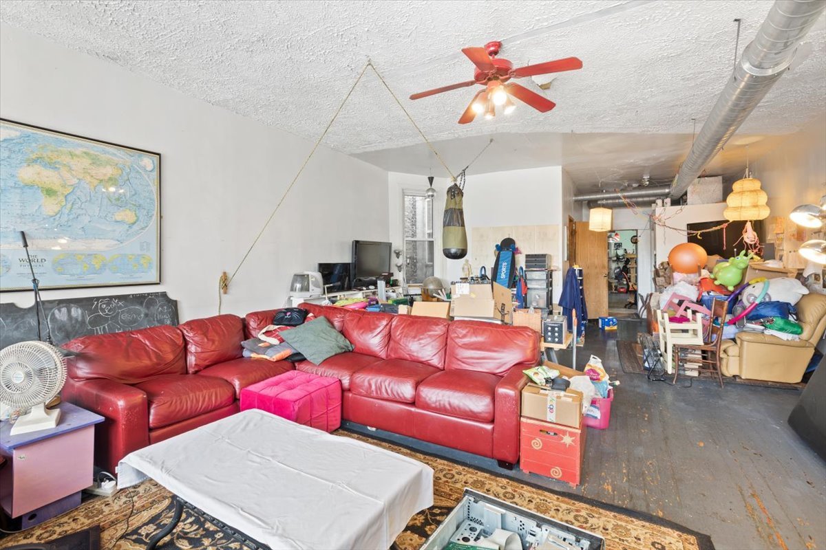 2605 West Division Street Chicago, IL 60622 - Photo 5 of 28 a living room with furniture a table and chairs