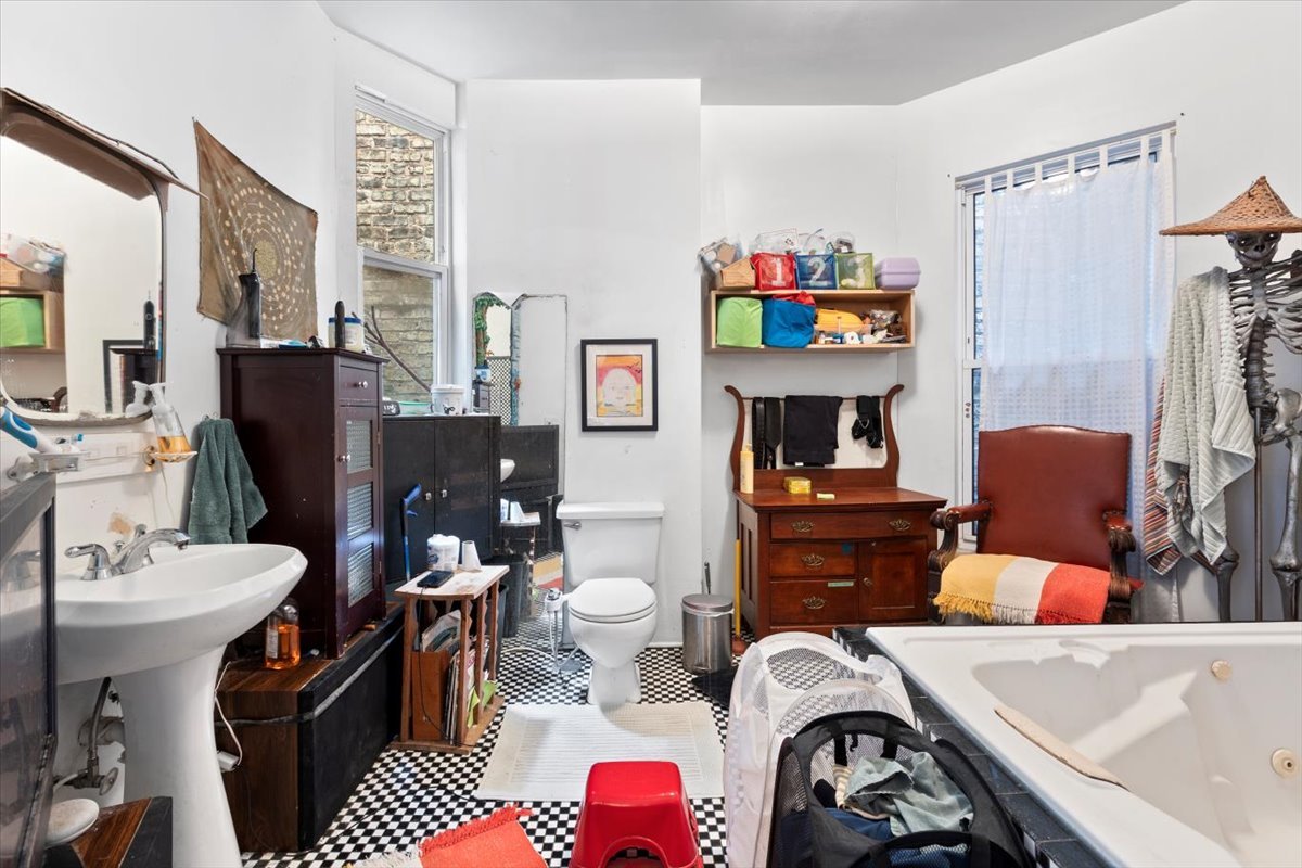 2605 West Division Street Chicago, IL 60622 - Photo 7 of 28 a living room with furniture a rug and a fireplace