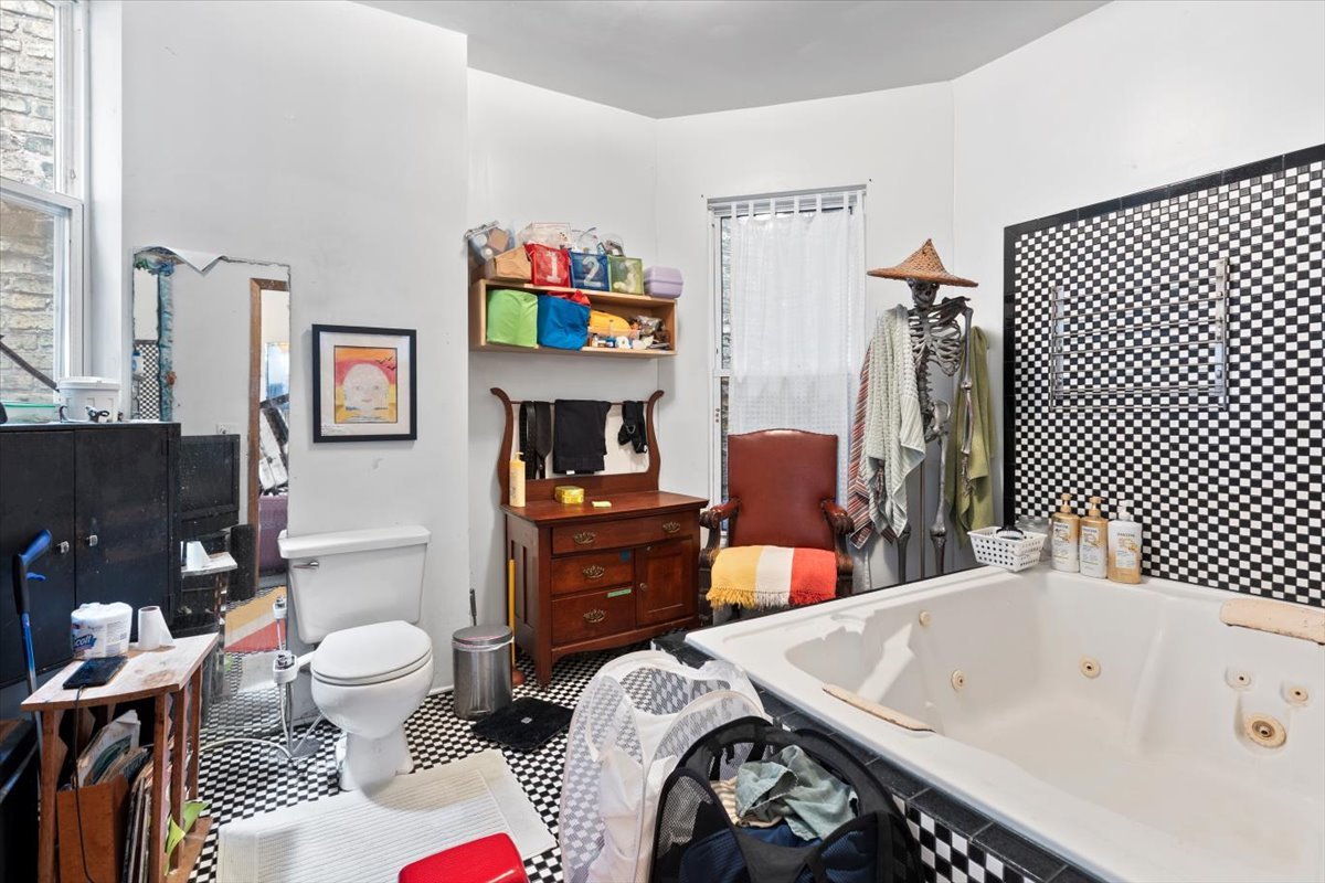 2605 West Division Street Chicago, IL 60622 - Photo 8 of 28 a bedroom with a bed and a dresser