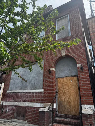 a brick building with a white door
