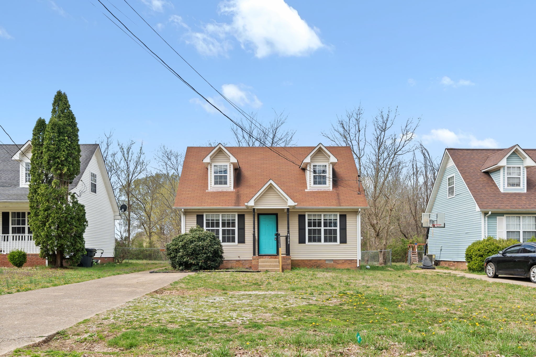 a front view of a house with a yard