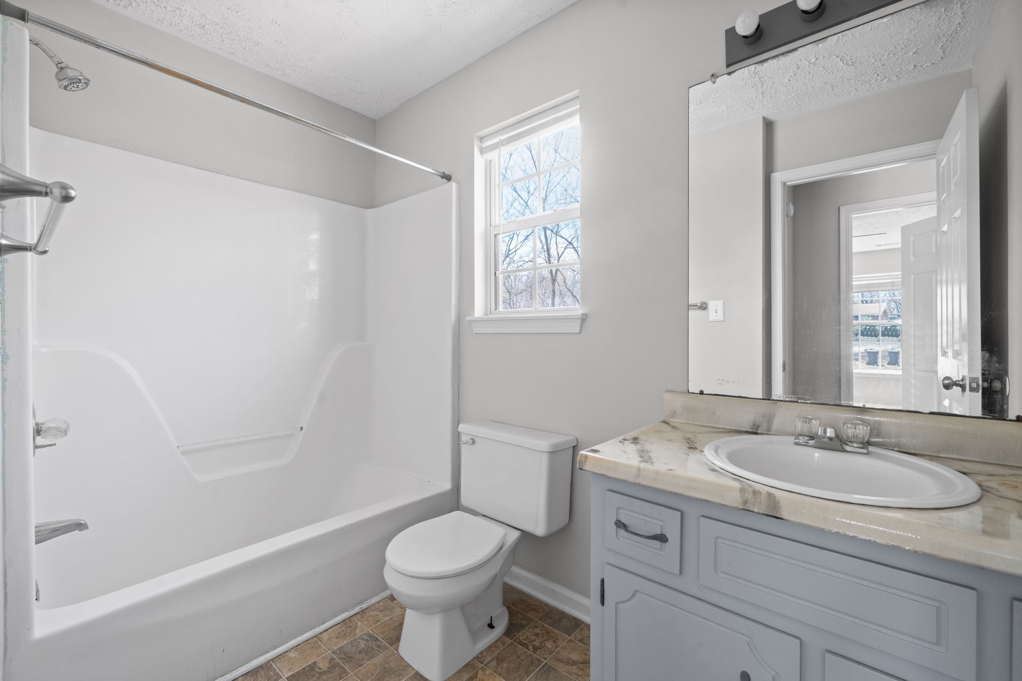 9193 Pembroke Oak Grove Road Oak Grove, KY 42262 - Photo 12 of 18 a bathroom with a sink toilet a mirror and shower