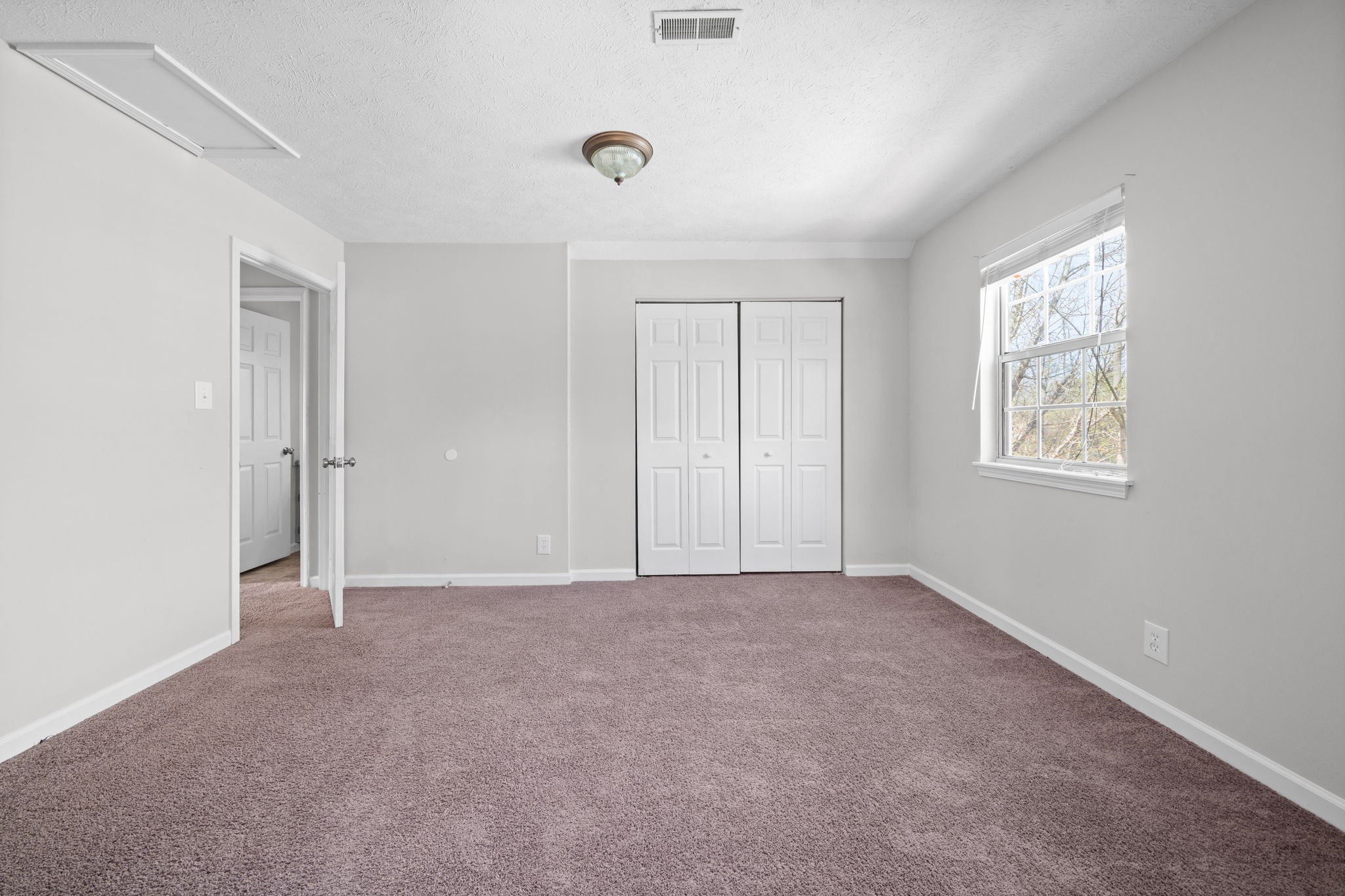 9193 Pembroke Oak Grove Road Oak Grove, KY 42262 - Photo 14 of 18 an empty room with windows and closet