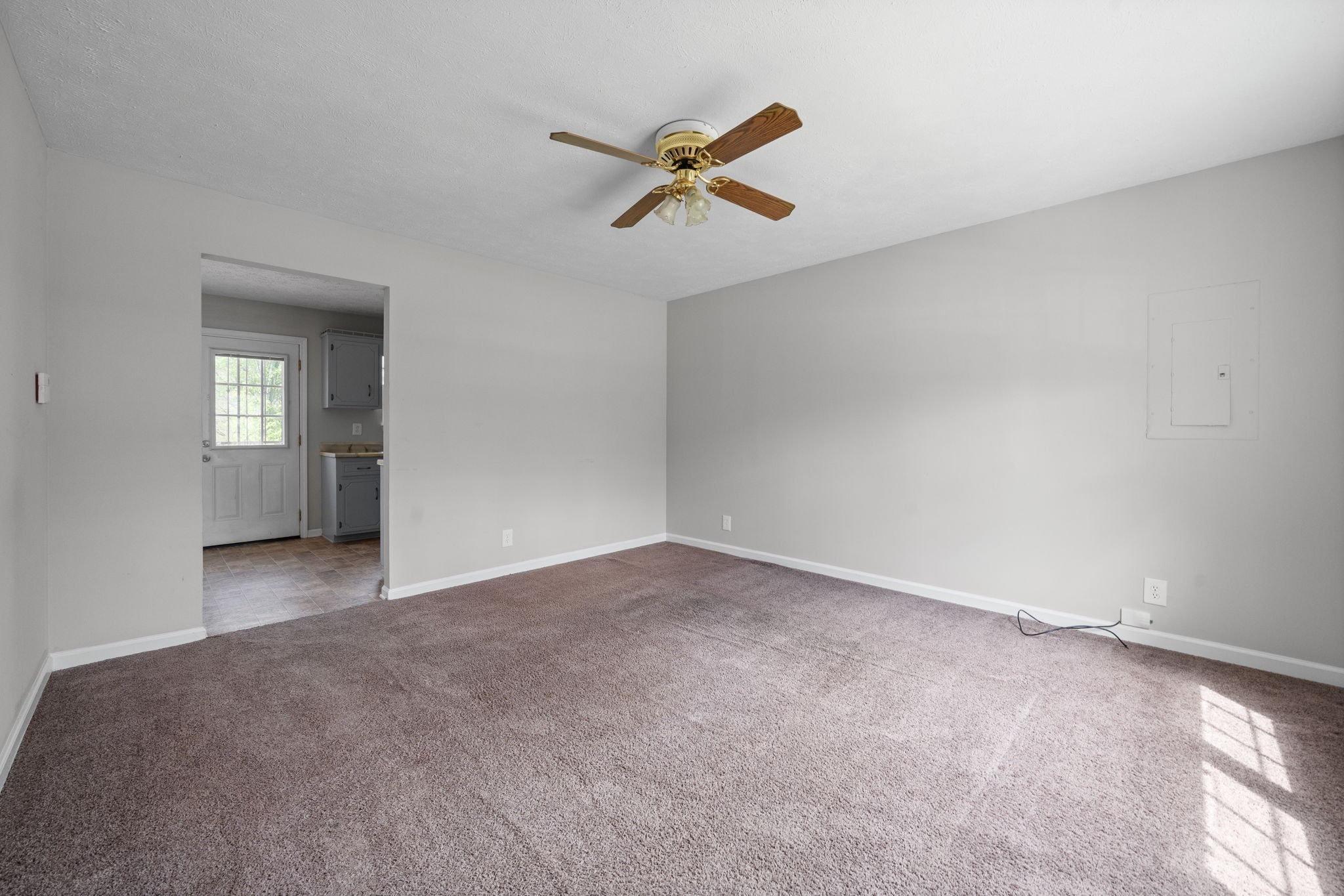 9193 Pembroke Oak Grove Road Oak Grove, KY 42262 - Photo 3 of 18 an empty room with a ceiling fan and window