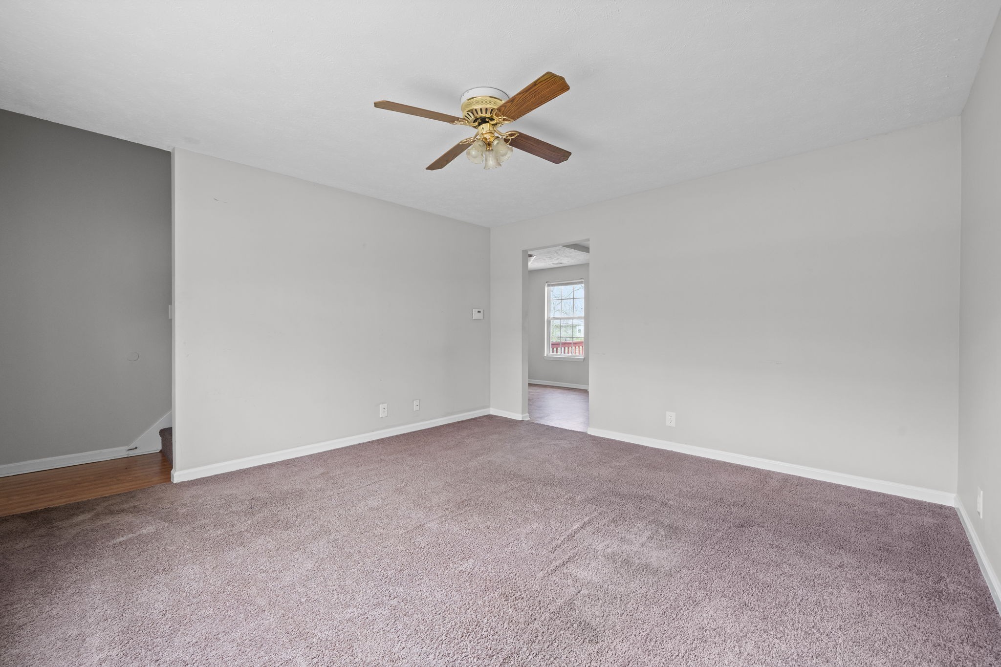 9193 Pembroke Oak Grove Road Oak Grove, KY 42262 - Photo 5 of 18 a view of a livingroom with a ceiling fan and window