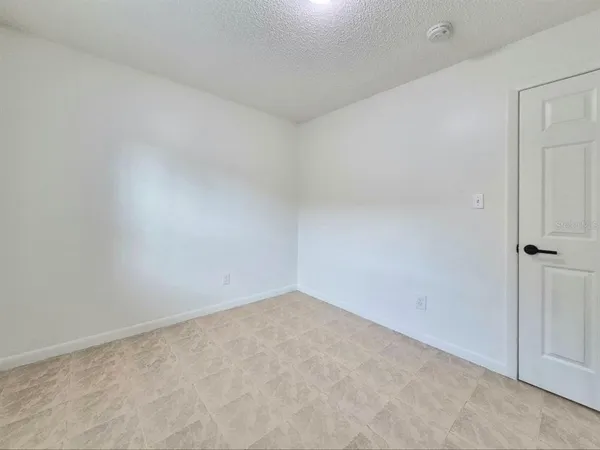 a bathroom with a toilet and a bathtub