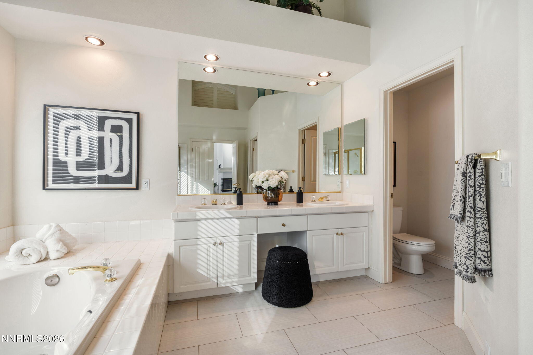 6186 Squires Lane Reno, NV 89519 - Photo 27 of 57 a spacious bathroom with a double vanity sink toilet and shower