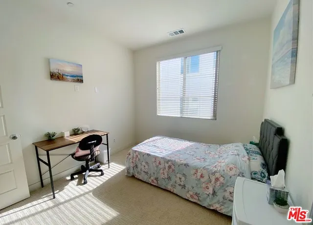 a bathroom with a sink mirror vanity and toilet