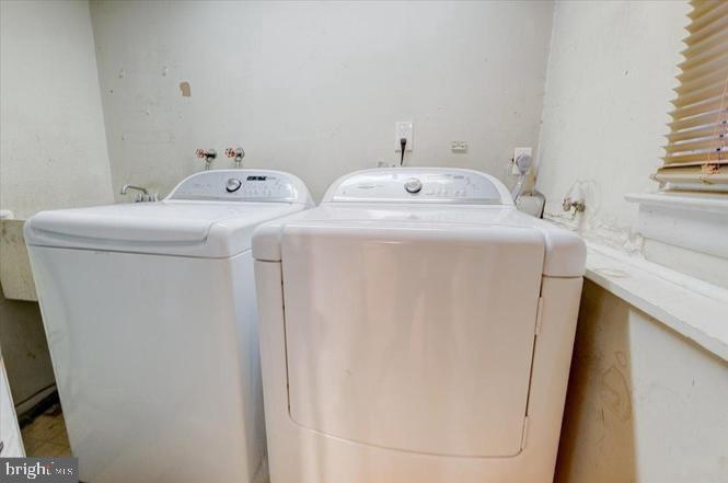 219 Fairview Avenue Lawnside, NJ 08045 - Photo 16 of 21 a utility room with dryer and washer