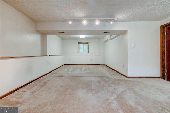 219 Fairview Avenue Lawnside, NJ 08045 - Photo 18 of 21 an empty room with a empty space and windows