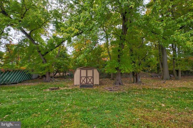 219 Fairview Avenue Lawnside, NJ 08045 - Photo 20 of 21 a view of a backyard with a garden and trees