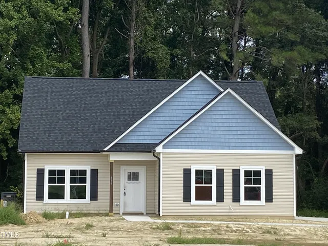 a house with trees in the background