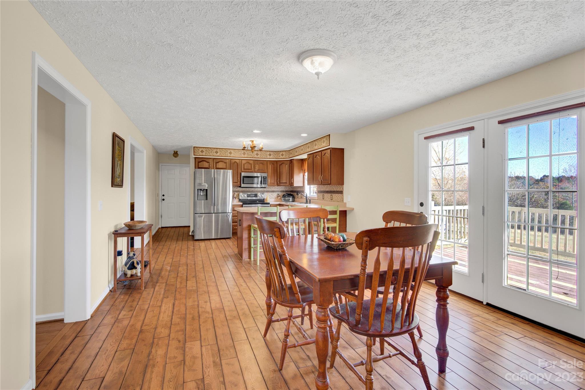 307 Rupard Road Statesville, NC 28625 - Photo 13 of 36 a view of a dining room with furniture and wooden floor