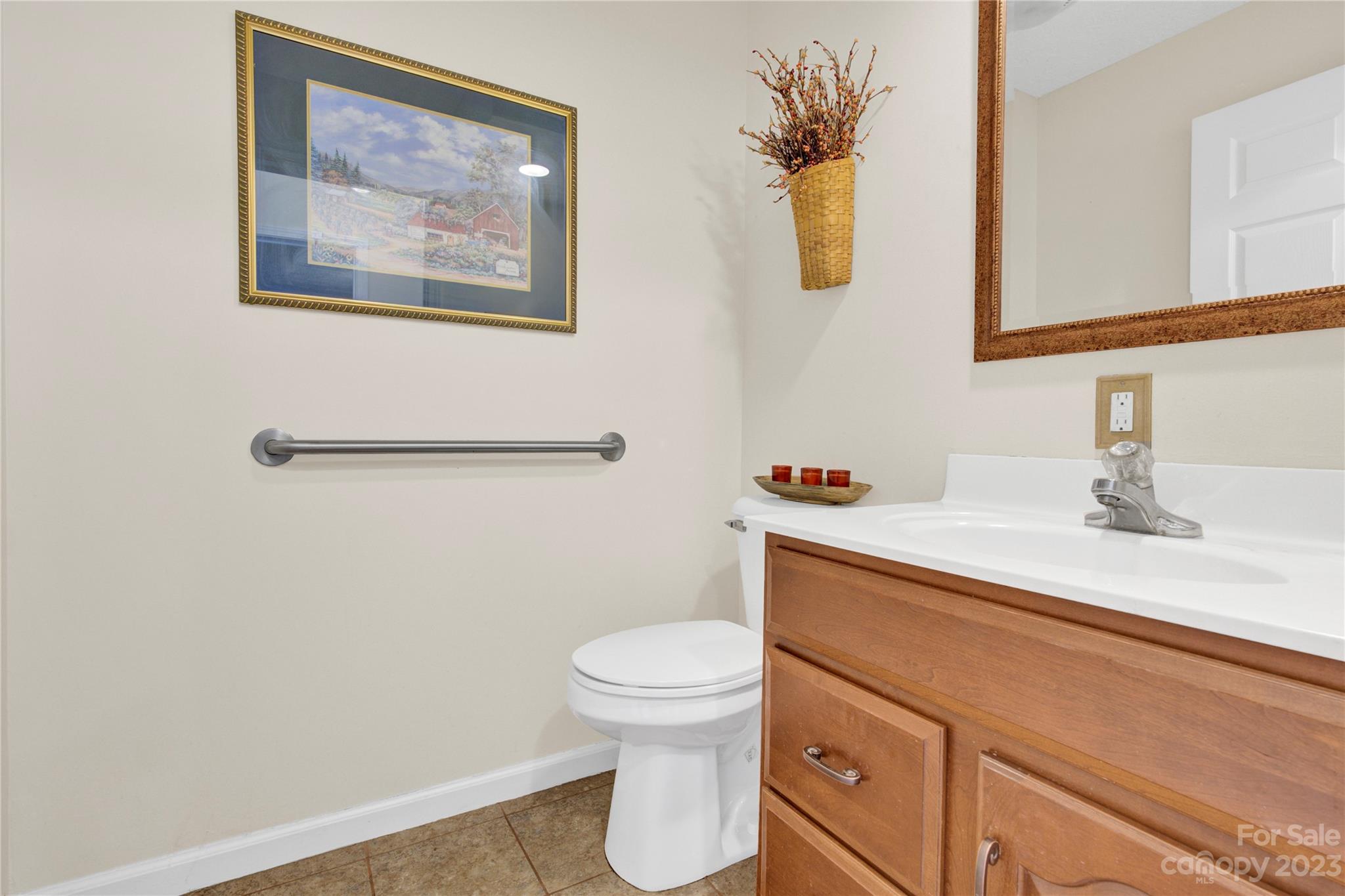 307 Rupard Road Statesville, NC 28625 - Photo 17 of 36 a bathroom with a toilet sink and mirror