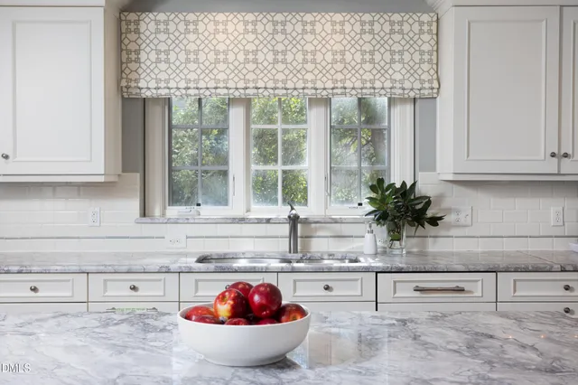 a kitchen with stainless steel appliances granite countertop a stove a sink and dishwasher