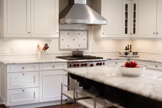 a living room with furniture a rug and a fireplace
