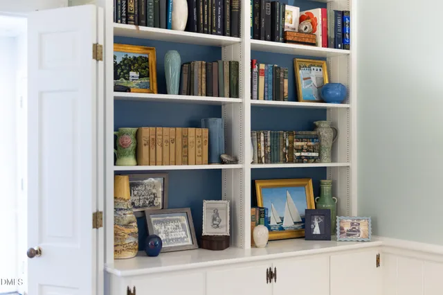 a front view of a house with swimming pool and sitting area