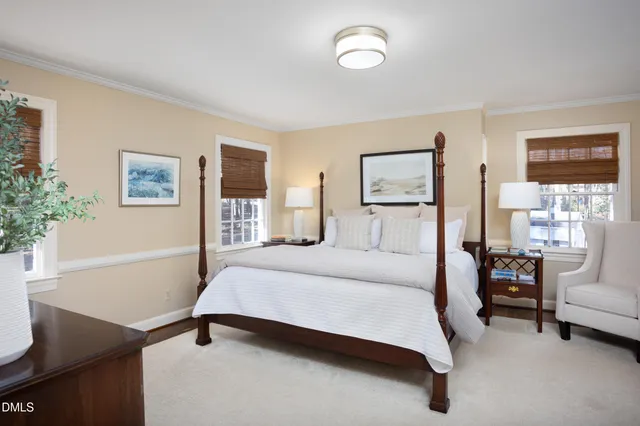 a view of a brick wall with a tree in the background