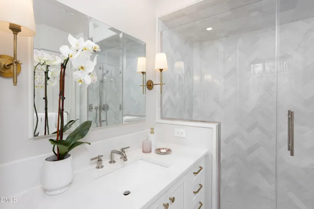 a front view of a house with yard and trees