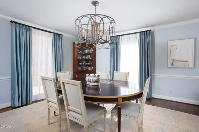 a kitchen with refrigerator cabinets and wooden floor