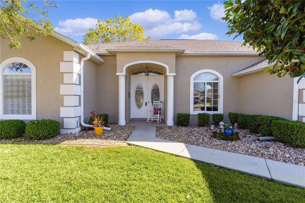 2465 Northwest 53rd Avenue Road Ocala, FL 34482 - Photo 1 of 1 a front view of a house with garden
