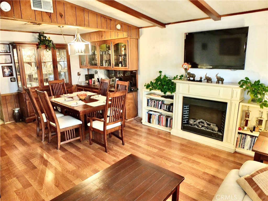 2601 East Victoria Street, Unit 439 Rancho Dominguez, CA 90220 - Photo 19 of 32 a outdoor space with furniture a flat screen tv and a fireplace