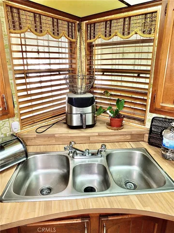 a kitchen with a stove and a refrigerator