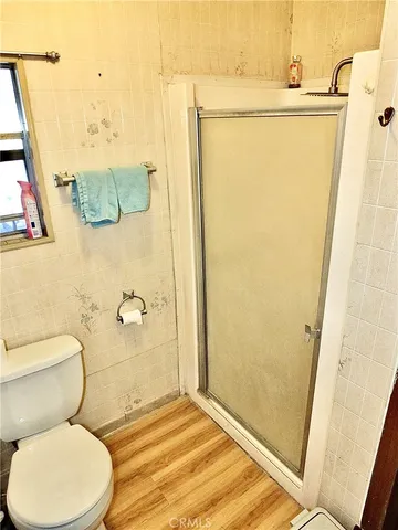 a bathroom with a tub a sink and a window