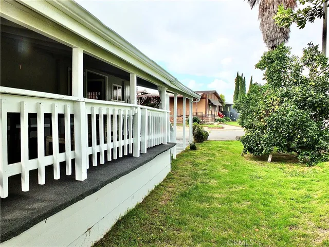 a view of a patio with chairs and table in the patio