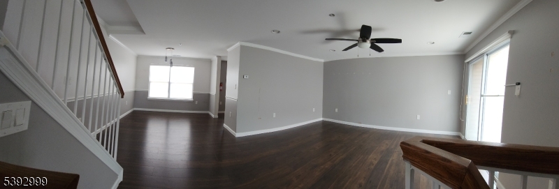 532 Great Beds Court, Unit 532 Perth Amboy, NJ 08861 - Photo 2 of 13 a view of empty room with wooden floor and fan