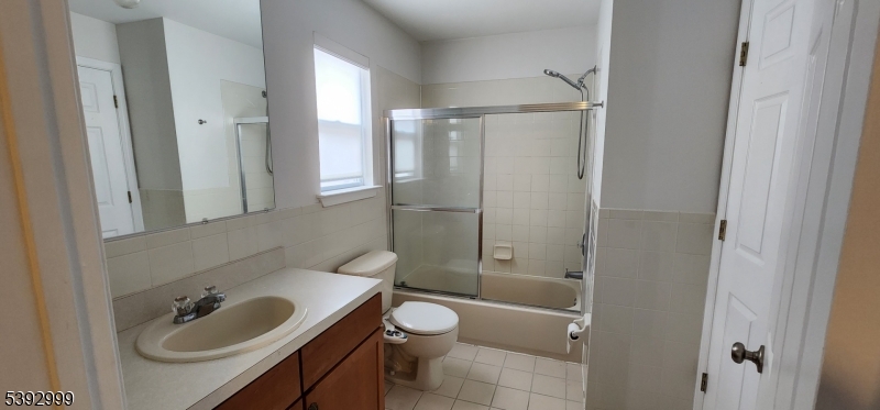 532 Great Beds Court, Unit 532 Perth Amboy, NJ 08861 - Photo 7 of 13 a bathroom with a sink toilet and shower