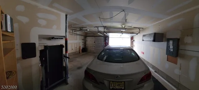 a kitchen with stainless steel appliances granite countertop a refrigerator a stove and a refrigerator