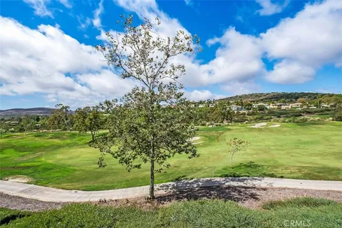 a bathroom with a bathtub a sink and a mirror