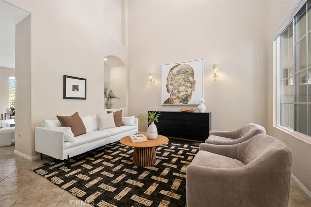 a kitchen with stainless steel appliances kitchen island granite countertop a sink and a refrigerator