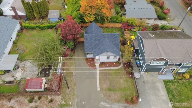 an aerial view of residential houses with outdoor space
