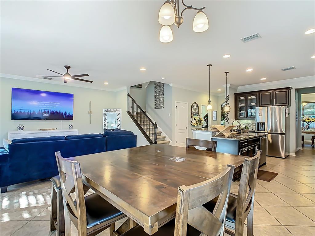 168 Magneta Loop Auburndale, FL 33823 - Photo 15 of 75 a dining room with furniture and wooden floor