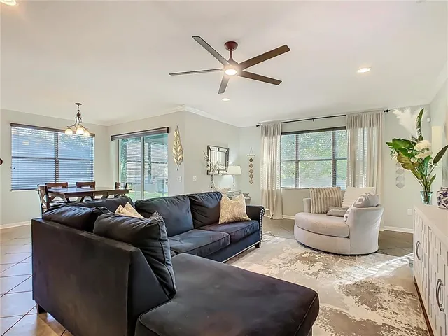 a living room with furniture a table and a flat screen tv