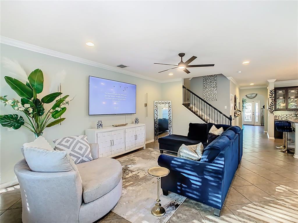 168 Magneta Loop Auburndale, FL 33823 - Photo 20 of 75 a living room with furniture flowerpot and wooden floor