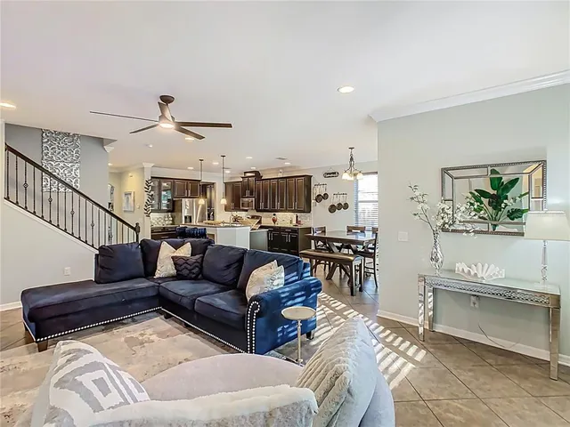 a bedroom with a bed a flat screen tv and dresser