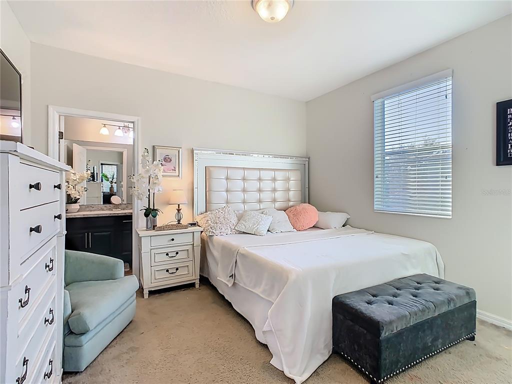 168 Magneta Loop Auburndale, FL 33823 - Photo 26 of 75 a bedroom with a bed and a dresser