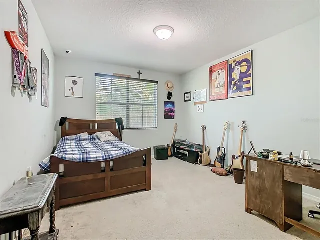 a bathroom with a granite countertop sink a large mirror and a bathtub