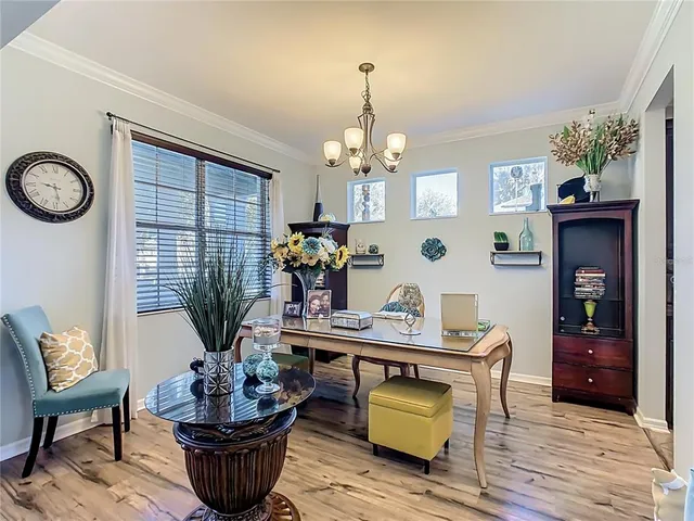 a dining room with furniture and window