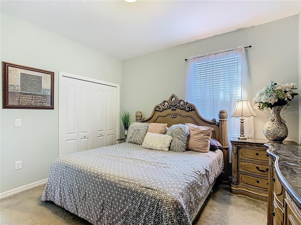 168 Magneta Loop Auburndale, FL 33823 - Photo 48 of 75 a bedroom with a bed and wooden floor