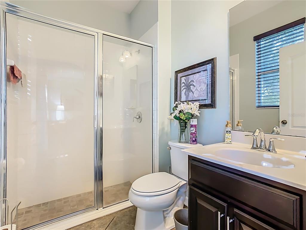 168 Magneta Loop Auburndale, FL 33823 - Photo 49 of 75 a bathroom with a sink toilet and shower