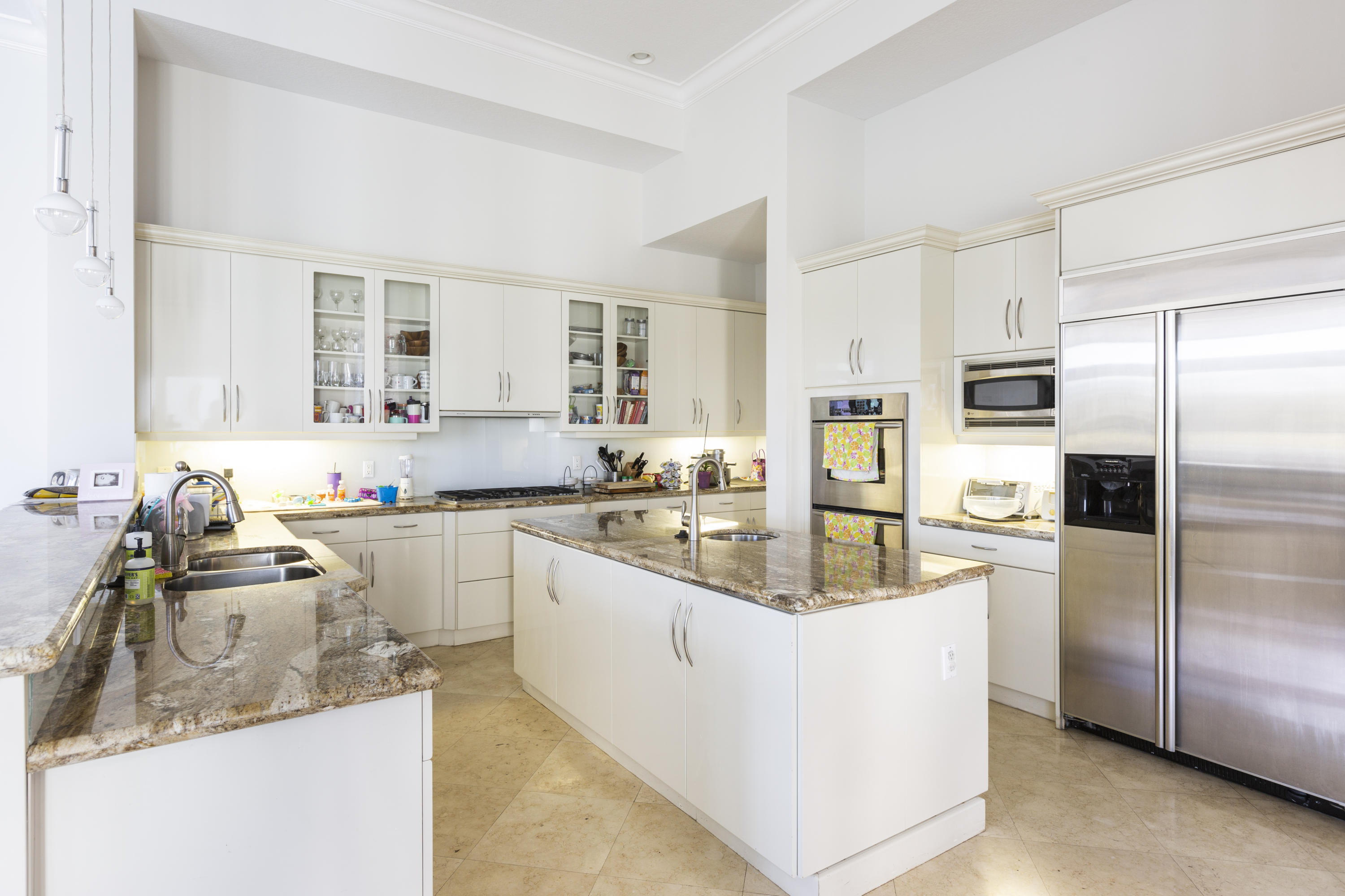 17706 Middlebrook Way Boca Raton, FL 33496 - Photo 18 of 61 a kitchen with stainless steel appliances granite countertop a sink stove refrigerator and cabinets