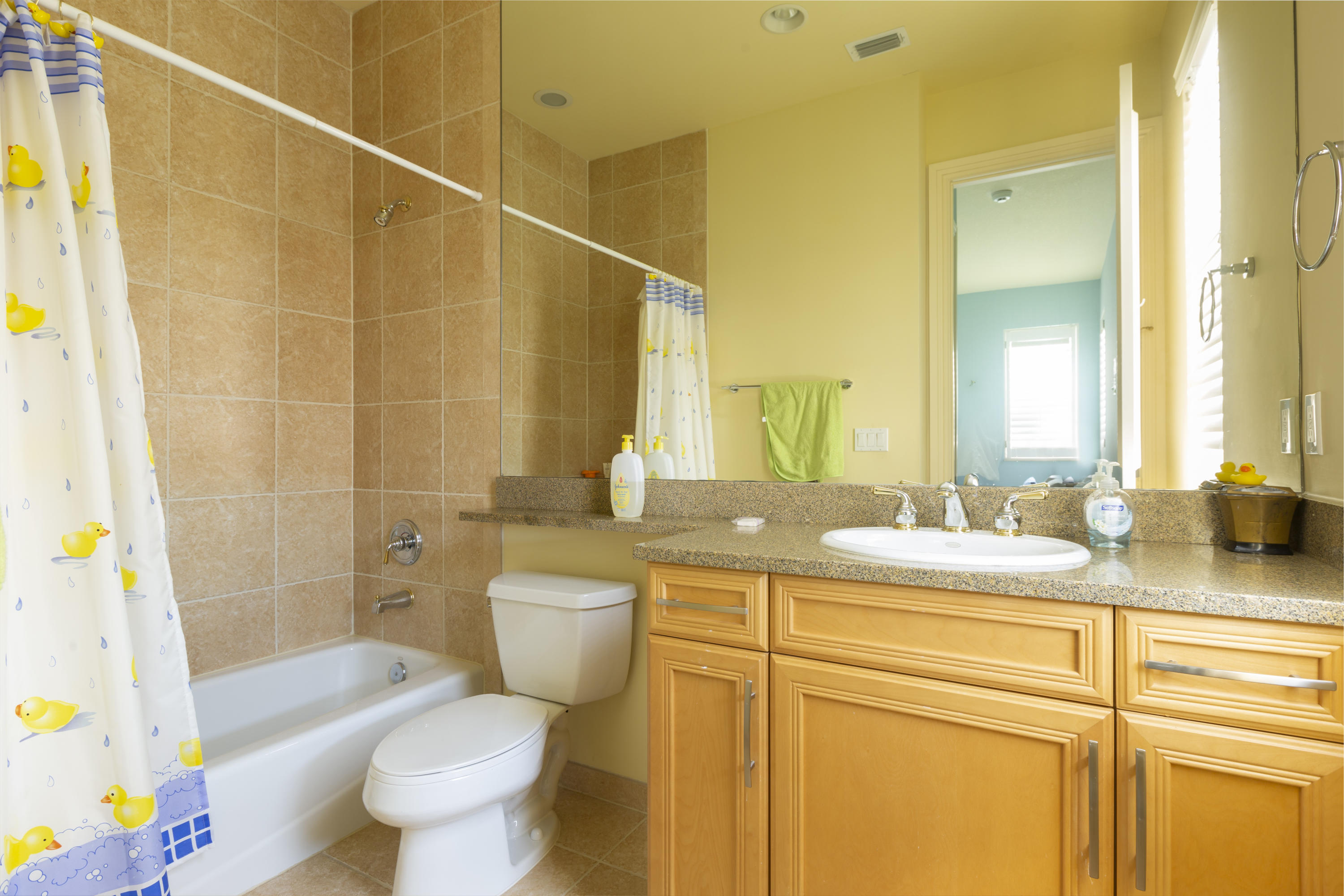 17706 Middlebrook Way Boca Raton, FL 33496 - Photo 34 of 61 a bathroom with a granite countertop sink toilet mirror vanity and bathtub